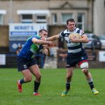 Heriots Ross Jones fends off Boroughmuirs Callum Ramm. FOSROC Super 6 match between Heriot's Rugby and Boroughmuir Bears at Goldenacre, Edinburgh on 09/10/2021. (Photo: 39 Design Photography)