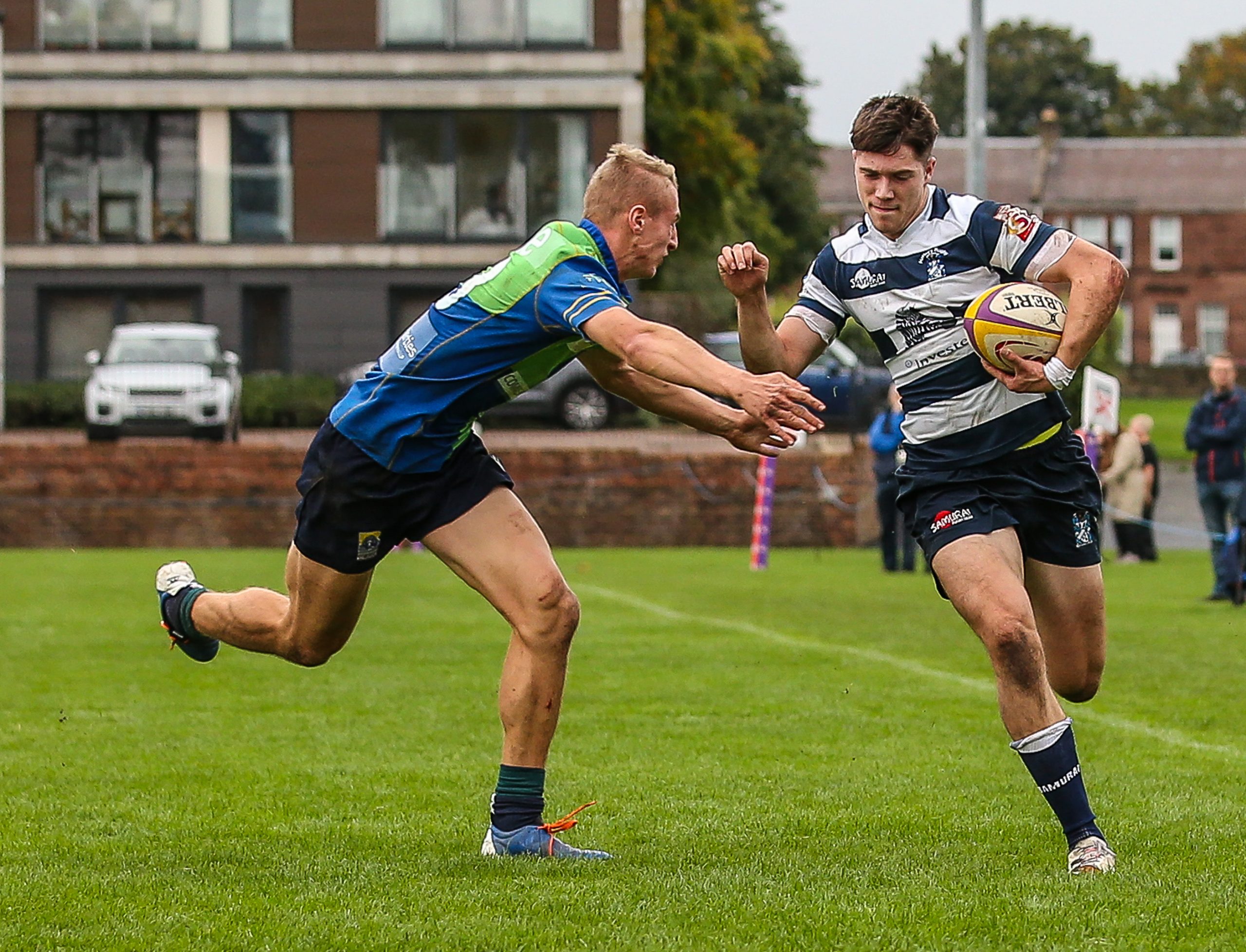 Heriots Ben Evans drives towards the line as Boroughmuirs Duncan Munn tries to make the tackle.FOSROC Super 6 match between Heriot's Rugby and Boroughmuir Bears at Goldenacre, Edinburgh on 09/10/2021. 

(Photo: 39 Design Photography)