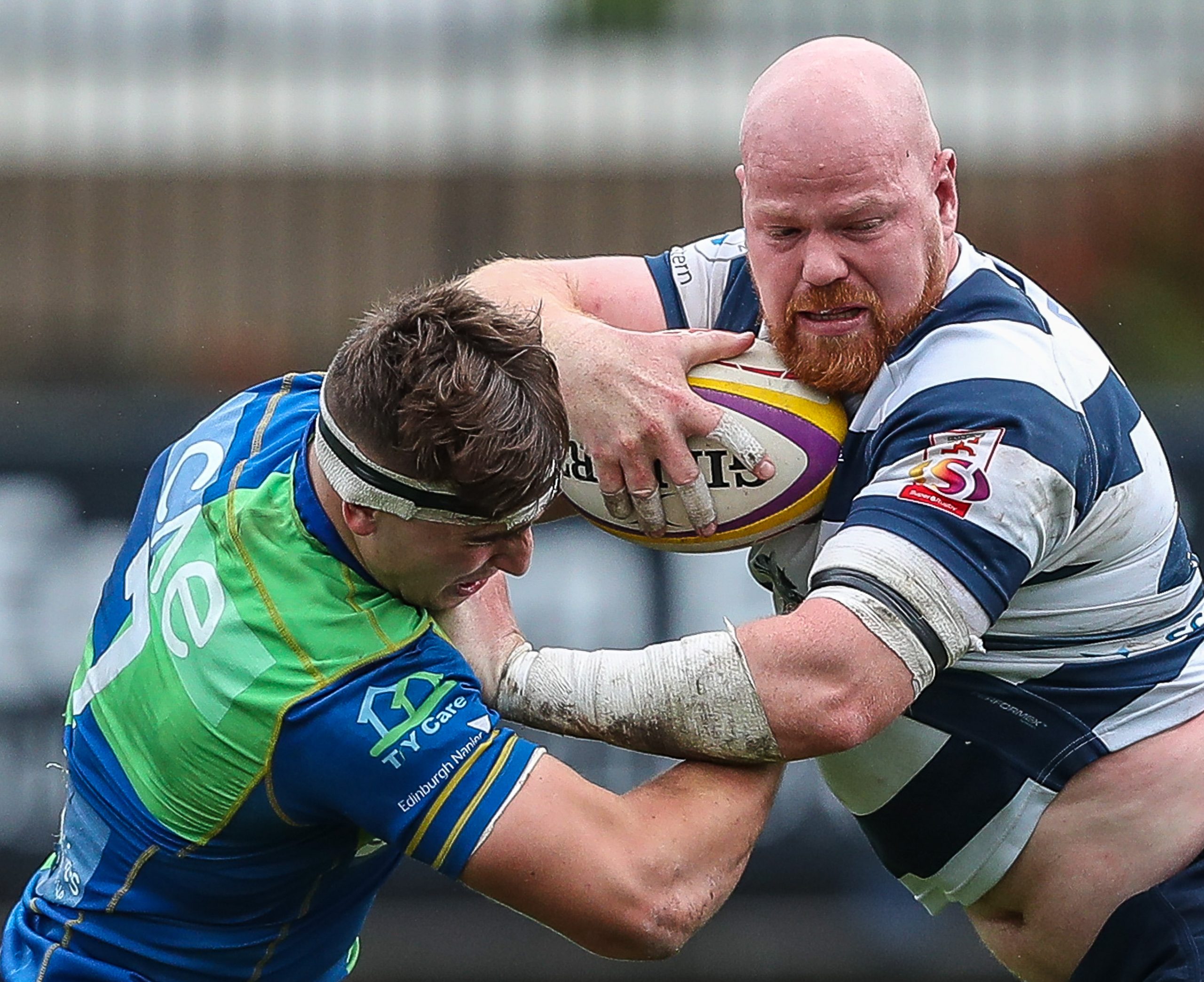 Heriots Jason Hill tries to break free from the tackle of Boroughmuirs Rhys Tait. FOSROC Super 6 match between Heriot's Rugby and Boroughmuir Bears at Goldenacre, Edinburgh on 09/10/2021. 

(Photo: 39 Design Photography)